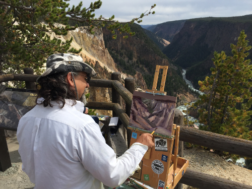 Daniel Hidalgo paints in Yellowstone National Park